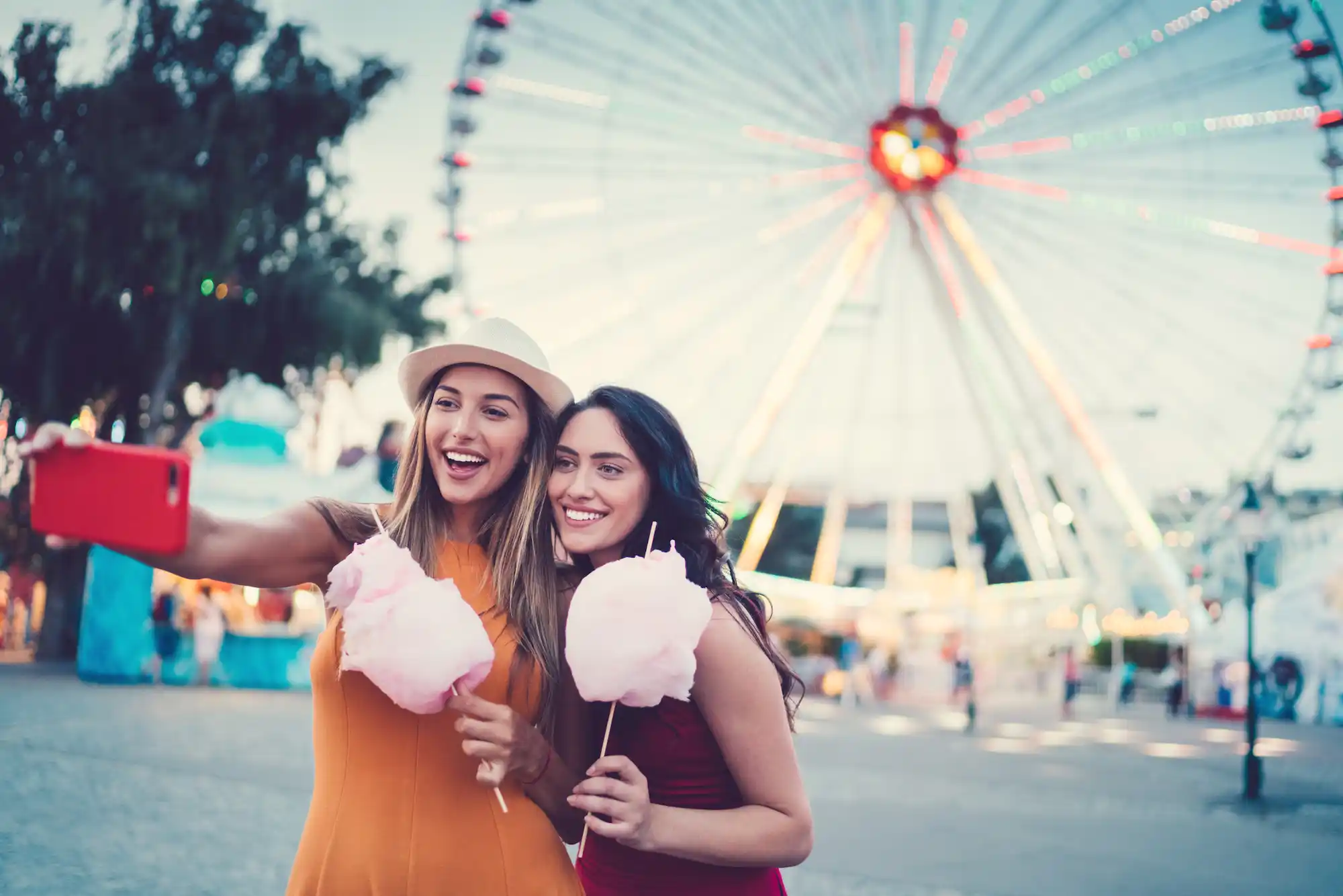 Women having fun at a local fair near Chateau de Ville Apartments