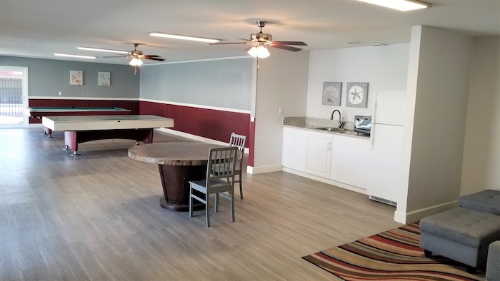 Resident clubhouse with kitchenette and billiards lounge, full view